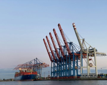 blue-and-red-cargo-ship-on-sea-during-daytime.jpg blue and red cargo ship on sea during daytime